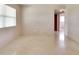 Bright living room with a view to other rooms and light terrazzo flooring at 5221 48Th N Ave, St Petersburg, FL 33709