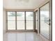 Enclosed sunroom featuring screened windows and plenty of natural light at 5221 48Th N Ave, St Petersburg, FL 33709