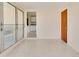 Versatile sunroom area with terrazzo flooring, offering a peaceful retreat at 5221 48Th N Ave, St Petersburg, FL 33709