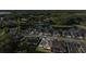 Aerial view of the property nestled in a desirable neighborhood near a peaceful lake at 6035 Nikki Ln, Odessa, FL 33556