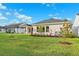 Well-maintained backyard featuring healthy grass, landscaping, and neutral exterior walls at 6035 Nikki Ln, Odessa, FL 33556