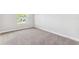 Bright, carpeted bedroom with baseboards and natural light at 6035 Nikki Ln, Odessa, FL 33556