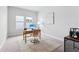 Bright home office features modern desk, neutral colors, and ample natural light from two windows at 6035 Nikki Ln, Odessa, FL 33556