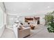 Bright, open-concept living space featuring kitchen, dining, and living areas at 6035 Nikki Ln, Odessa, FL 33556