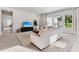 Inviting living room with plush seating and large windows, creating a bright and airy atmosphere at 6035 Nikki Ln, Odessa, FL 33556