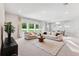 Open-concept living room showcasing seamless flow into the dining and kitchen areas at 6035 Nikki Ln, Odessa, FL 33556