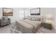 Stylish main bedroom with modern decor, comfortable bed, and designer accents for luxurious living at 6035 Nikki Ln, Odessa, FL 33556