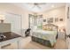 Bright bedroom featuring a desk and floral bedding at 6041 Sandhill Ridge Dr, Lithia, FL 33547