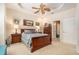 Spacious bedroom featuring a ceiling fan, neutral walls and carpet at 6041 Sandhill Ridge Dr, Lithia, FL 33547