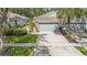 Charming single-story home with a two-car garage, well-manicured lawn, and an inviting driveway at 6041 Sandhill Ridge Dr, Lithia, FL 33547