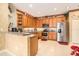 Well-lit kitchen with stainless steel appliances, tile flooring and decorative accents at 6041 Sandhill Ridge Dr, Lithia, FL 33547