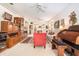 Bright living room with an archway, ceiling fan, vintage writing desk, and cozy furniture at 6041 Sandhill Ridge Dr, Lithia, FL 33547