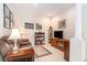 Cozy living room featuring a comfortable sofa, a bookshelf, and soft lighting for a relaxed atmosphere at 6041 Sandhill Ridge Dr, Lithia, FL 33547