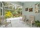 View of the screen enclosed patio, featuring seating, view of the yard, and decorations at 6041 Sandhill Ridge Dr, Lithia, FL 33547