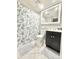 Bathroom featuring a shell-patterned shower curtain and a dark vanity at 630 Timber Bay W Cir, Oldsmar, FL 34677