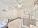 Bright Bedroom featuring a white crib, changing table, and neutral decor at 630 Timber Bay W Cir, Oldsmar, FL 34677