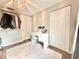 Bright walk-in closet with an open layout, desk, and plenty of storage at 630 Timber Bay W Cir, Oldsmar, FL 34677