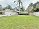 Charming single-story home featuring a well-manicured lawn and a two-car garage at 630 Timber Bay W Cir, Oldsmar, FL 34677