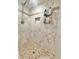 Tiled shower with a shower head, niche, and built-in shelving at 630 Timber Bay W Cir, Oldsmar, FL 34677