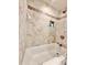 Cozy tiled shower over tub, with niche and neutral tile design at 630 Timber Bay W Cir, Oldsmar, FL 34677
