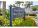 Townhomes at Kensington community sign surrounded by colorful foliage at 637 Kensington Lake Cir, Brandon, FL 33511