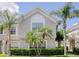 Charming two-story home with lush landscaping and palm trees providing curb appeal and tropical flair at 637 Kensington Lake Cir, Brandon, FL 33511