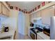 Functional kitchen featuring updated appliances, light cabinetry, and efficient layout at 637 Kensington Lake Cir, Brandon, FL 33511