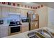 Well-maintained kitchen with stainless steel appliances and ample cabinet space at 637 Kensington Lake Cir, Brandon, FL 33511