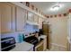 Efficient kitchen design with light-colored cabinets, modern appliances, and easy access at 637 Kensington Lake Cir, Brandon, FL 33511