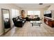 Spacious living room featuring tile floors, comfortable seating, and ample natural light at 637 Kensington Lake Cir, Brandon, FL 33511