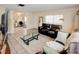 Open living room with tile floors, large windows, and a seamless transition to the dining area at 637 Kensington Lake Cir, Brandon, FL 33511