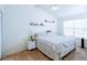 Bright main bedroom featuring a ceiling fan, neutral carpet, and stylish decor shelving for a neat, comfortable space at 637 Kensington Lake Cir, Brandon, FL 33511