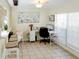 Bright office area with a large desk, barstool seating, and plenty of natural light at 637 Kensington Lake Cir, Brandon, FL 33511