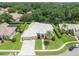 Beautiful home showcasing manicured lawn, mature landscaping and neutral color palette at 6905 Arabian Rd, Odessa, FL 33556