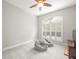 Cozy bedroom with carpeted floor, big window with shutters and ceiling fan at 6905 Arabian Rd, Odessa, FL 33556