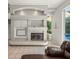 Beautifully designed fireplace with pool view in living room with tile flooring at 6905 Arabian Rd, Odessa, FL 33556