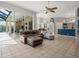 Large living room with tile floors and access to the lanai, kitchen and dining room at 6905 Arabian Rd, Odessa, FL 33556