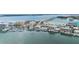 Aerial view of the coastline in Clearwater Beach near the water with yachts docked in front of condos and businesses at 706 Bayway Blvd # 503, Clearwater, FL 33767