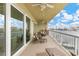 Large, covered balcony with seating area and views of the bay at 706 Bayway Blvd # 503, Clearwater, FL 33767
