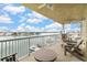 Spacious balcony with chairs and table, overlooking beautiful waterway at 706 Bayway Blvd # 503, Clearwater, FL 33767