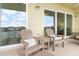 Cozy balcony seating area with bay view, perfect for relaxation at 706 Bayway Blvd # 503, Clearwater, FL 33767