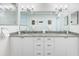 Bright bathroom with double sinks, granite countertops, vanity and walk-in shower at 706 Bayway Blvd # 503, Clearwater, FL 33767