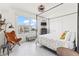 Light and airy bedroom with ample natural light, decorative touches, and tile flooring at 706 Bayway Blvd # 503, Clearwater, FL 33767