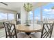 Bright dining room with water views and modern chandelier lighting fixture at 706 Bayway Blvd # 503, Clearwater, FL 33767