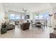 Open living area featuring tiled floors, a ceiling fan, and a dining area with views of the city at 706 Bayway Blvd # 503, Clearwater, FL 33767