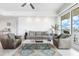 Inviting living room with comfortable seating, area rug, and a view of the waterfront at 706 Bayway Blvd # 503, Clearwater, FL 33767