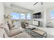 Cozy living room with stylish furniture and water views, perfect for relaxation and entertainment at 706 Bayway Blvd # 503, Clearwater, FL 33767