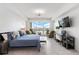 Bright, spacious main bedroom with balcony access and water view at 706 Bayway Blvd # 503, Clearwater, FL 33767