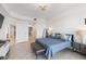 Comfortable bedroom showcasing blue comforter, tile floors, and natural lighting at 706 Bayway Blvd # 503, Clearwater, FL 33767