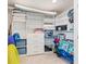 Walk in storage area with organized shelving, perfect for beach equipment at 706 Bayway Blvd # 503, Clearwater, FL 33767